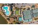 A stunning aerial view showcasing a pool, bocce ball and tennis courts in this community at 303 Sand Dune Trl, Summerville, SC 29486