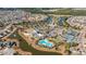 Discover a vibrant community from above with a pool, tennis courts and manicured lawns at 303 Sand Dune Trl, Summerville, SC 29486