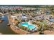 Aerial view highlighting a community with amenities including a pool, lake, clubhouse, and tennis courts at 303 Sand Dune Trl, Summerville, SC 29486