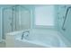 Bathroom boasts tub, shower, and neutral paint at 303 Sand Dune Trl, Summerville, SC 29486