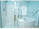 Modern bathroom featuring a separate shower and soaking tub combo with stylish glass door and updated fixtures at 303 Sand Dune Trl, Summerville, SC 29486