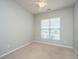 Bedroom with neutral walls, carpet, and a window providing natural light at 303 Sand Dune Trl, Summerville, SC 29486