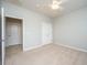 A bright bedroom featuring neutral walls, carpet, and a ceiling fan for added comfort at 303 Sand Dune Trl, Summerville, SC 29486