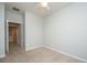 Bedroom with neutral walls, carpet, and an open doorway leading to other rooms at 303 Sand Dune Trl, Summerville, SC 29486