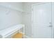 A storage closet with door, white shelving, and a small table for organization at 303 Sand Dune Trl, Summerville, SC 29486
