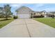 Charming single-Gathering home with a well-manicured lawn, mature tree, and covered front porch at 303 Sand Dune Trl, Summerville, SC 29486
