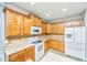 Kitchen with wood cabinets, tiled backsplash, and stainless steel appliances at 303 Sand Dune Trl, Summerville, SC 29486