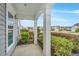 Inviting porch with white columns, manicured landscaping, offering a glimpse of the friendly neighborhood at 303 Sand Dune Trl, Summerville, SC 29486