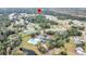 Expansive aerial view of a neighborhood surrounded by mature trees and community pool at 3109 Hugh Bennett Dr, Johns Island, SC 29455