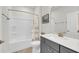 Bright bathroom featuring a shower-tub combo with gray vanity and modern fixtures at 3109 Hugh Bennett Dr, Johns Island, SC 29455