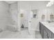 Modern bathroom with a tiled shower, double vanity, and sleek fixtures at 3109 Hugh Bennett Dr, Johns Island, SC 29455
