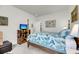 Bedroom featuring a four-poster bed and unique dresser with mounted TV at 3109 Hugh Bennett Dr, Johns Island, SC 29455