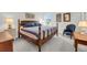 Bedroom featuring a four-poster bed, hardwood furnishings, and natural light at 3109 Hugh Bennett Dr, Johns Island, SC 29455