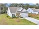 Charming single-Gathering home with a two-car garage, beautiful landscaping, and a well-manicured lawn at 3109 Hugh Bennett Dr, Johns Island, SC 29455