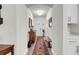 Hallway with hardwood floors, wooden bench, and neutral wall paint at 3109 Hugh Bennett Dr, Johns Island, SC 29455