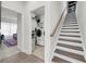 Hallway with stairs and laundry area featuring modern washer and dryer at 3109 Hugh Bennett Dr, Johns Island, SC 29455