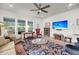 Cozy living room with views of the outdoors, a ceiling fan, and comfortable seating at 3109 Hugh Bennett Dr, Johns Island, SC 29455
