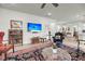 Open-concept living space featuring a flat-screen TV, comfortable seating, and stylish decor at 3109 Hugh Bennett Dr, Johns Island, SC 29455