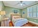 Charming bedroom featuring hardwood floors, plantation shutters, and neutral paint at 312 President St, Charleston, SC 29403