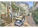 Charming home featuring a well-manicured yard, porch, and private brick-paved drive. Golf cart included at 312 President St, Charleston, SC 29403