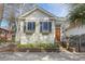 Charming house exterior with light yellow siding, shutters, and flower boxes under the windows at 312 President St, Charleston, SC 29403