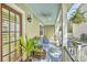Inviting porch with comfortable seating, a ceiling fan, and charming decor, perfect for relaxing at 312 President St, Charleston, SC 29403
