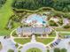 Aerial view of pool with waterslide and clubhouse overlooking landscape at 3125 Sturbridge Rd, Mount Pleasant, SC 29466