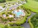 Aerial view of the pool with a water slide, landscaping, and walking paths at 3125 Sturbridge Rd, Mount Pleasant, SC 29466