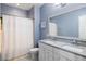 Well-lit bathroom features a double vanity, spacious countertop, and a shower/tub combination with modern fixtures at 3125 Sturbridge Rd, Mount Pleasant, SC 29466