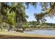 The serene waterfront view with chairs offers a tranquil space for relaxation at 3125 Sturbridge Rd, Mount Pleasant, SC 29466
