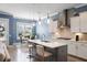 Beautiful kitchen with modern island, stainless hood, lighting, and eat-in breakfast area at 3125 Sturbridge Rd, Mount Pleasant, SC 29466