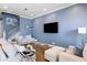 Inviting living room boasts neutral decor, ample seating, and a media center with a large-screen television at 3125 Sturbridge Rd, Mount Pleasant, SC 29466