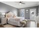 Elegant main bedroom with a tufted headboard, soft lighting, and tasteful décor creates a relaxing retreat at 3125 Sturbridge Rd, Mount Pleasant, SC 29466