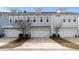 Charming townhomes featuring attached garages and colorful facades at 3125 Sturbridge Rd, Mount Pleasant, SC 29466