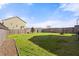 Well-maintained backyard featuring green grass, a fence, and garden beds at 324 Saucer Rd, Summerville, SC 29486