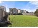 Large backyard with lush green grass and a privacy fence at 324 Saucer Rd, Summerville, SC 29486