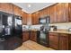 Kitchen with dark wood cabinets, granite countertops, and stainless steel appliances at 324 Saucer Rd, Summerville, SC 29486