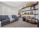 Comfortable living room area with a gray couch, decorative shelves, and natural light at 324 Saucer Rd, Summerville, SC 29486