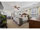 Spacious bedroom features a decorative headboard, ceiling fan, and an adjoining sitting area at 324 Saucer Rd, Summerville, SC 29486