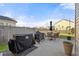 Backyard patio with outdoor seating, barbecue grill, and a fenced perimeter at 324 Saucer Rd, Summerville, SC 29486
