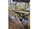 A wooden structure above a river or water body, potentially a dock or pier with supporting beams at 3695 Cannon Rd, Round O, SC 29474