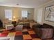Inviting living room with large windows, comfortable seating, and colorful rug at 3695 Cannon Rd, Round O, SC 29474