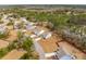 Aerial view showcases homes in a community with manicured lawns and mature trees at 4045 Oxeye Loop, Johns Island, SC 29455