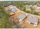 An aerial view displays a neighborhood with manicured lawns and mature trees at 4045 Oxeye Loop, Johns Island, SC 29455