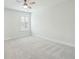 A bright bedroom featuring a window with white blinds and soft carpeting at 4045 Oxeye Loop, Johns Island, SC 29455