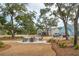 Community fire pit with Adirondack chairs offers residents a space to gather and relax outdoors at 4045 Oxeye Loop, Johns Island, SC 29455
