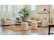 Comfortable living room with stylish decor, including a jute rug, plants, and a modern floor lamp at 4045 Oxeye Loop, Johns Island, SC 29455