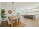 Open-concept living space with a dining area, living area, and modern kitchen at 4045 Oxeye Loop, Johns Island, SC 29455