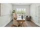 A well-lit office space with plantation shutters, a modern desk, and neutral decor creating a serene work environment at 4045 Oxeye Loop, Johns Island, SC 29455