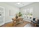A well-lit office space with plantation shutters, a modern desk, and neutral decor creating a serene work environment at 4045 Oxeye Loop, Johns Island, SC 29455